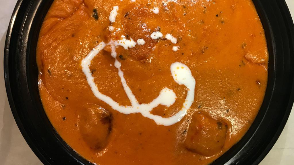 Chicken Tikka Masala · chicken tikka masala, rice, naan, and yellow daal.