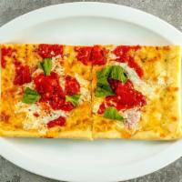 Grandma Pizza Slice · Thin crispy square slice with mozzarella cheese, garlic and seasoned grandma sauce.