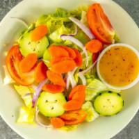 Garden Salad · Fresh lettuce, tomatoes, green peppers, red onions, cucumbers, and black olives.