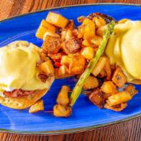 Stax Benny · Poached eggs, canadian bacon, hollandaise sauce on a toasted english muffin. Served with hom...