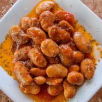 Gigantes · Traditional tender giant beans cooked in a rich tomato sauce until perfectly tender