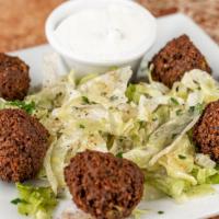 Falafel App · Chickpea patties on a bed of lettuce with tzatziki.