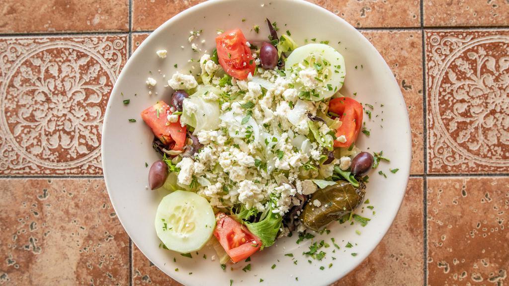 Greek Salad · Lettuce, tomatoes, cucumbers, onions, dolmades, olives and imported Greek feta and our homemade extra virgin olive oil and red wine vinaigrette.