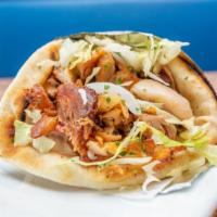 Chicken Gyro Sandwich · Chicken gyro with tomatoes, onions, lettuce, tzatziki and parsley