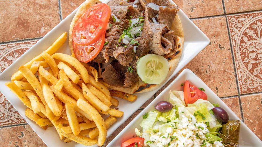 Gyro Platter · Served with Greek salad, pita bread, tzatziki sauce, garnished with tomato, onions, and cucumber.