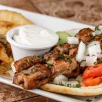 Souvlaki Pork Tenderloin Kebab Platter · 2 skewers. Served with Greek salad, pita bread, tzatziki sauce, garnished with tomato, onion...