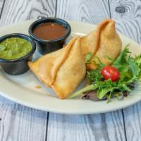 Samosa Vegetable · Two Crispy samosas deliciously filled with mildly spiced potatoes and. green peas.