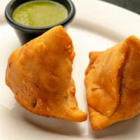 Chicken Samosa · Two Crispy samosas deliciously filled with mildly spiced minced chicken. (keema) and green p...