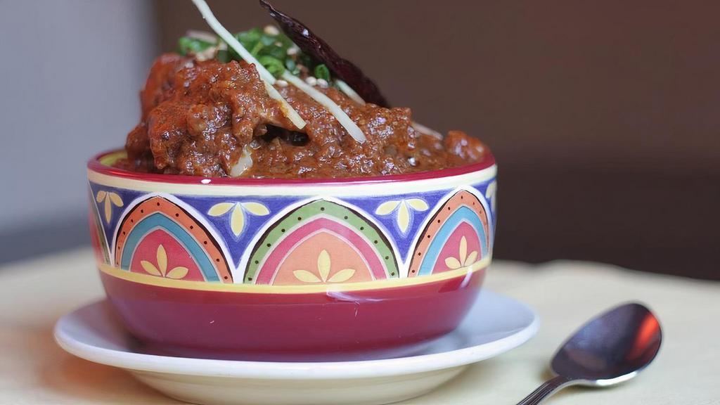 Handi Goat Masala - Entree · Goat cooked in a traditional onion based. gravy and a blend of spices.