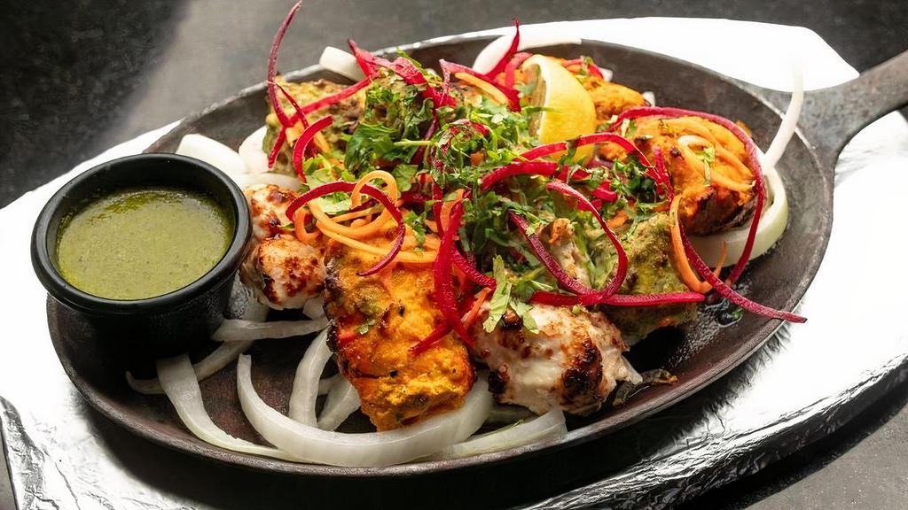 Chicken Malai Kebab - Entree · Boneless chicken breast pieces marinated with fresh coriander,. char-grilled to perfection on a skewer.