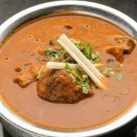 Aag Gosht - Entree · Goat cooked with khada masalas in an onion based . gravy with coriander, cinnamon, clove and...