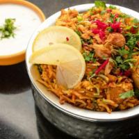 Chicken Biryani · Basmati rice flavored with saffron, sealed with masala chicken and. cooked on slow fire. Ser...
