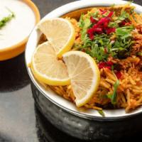 Lamb Biryani · Basmati rice flavored with saffron, sealed with masala lamb and. cooked on slow fire to seal...