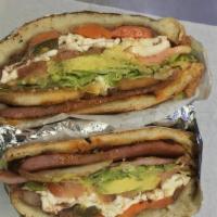 Cuban Torta · Sausage, chicken cutlet, avocado, lettuce, tomato, Mexican cheese,jalapeño, chipotle, mayonn...