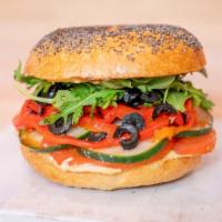 Hummus Delight · hummus, cucumber, roasted peppers, tomato, black olives, arugula, balsamic glaze