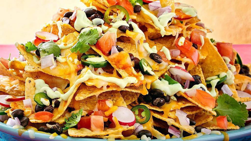 Nacho Mama'S · Tortilla chips topped with your meat choice, vegetarian options available, homemade beans, lettuce, cheese mix, jalapenos, cotija cheese, sour cream, pico de gallo.
