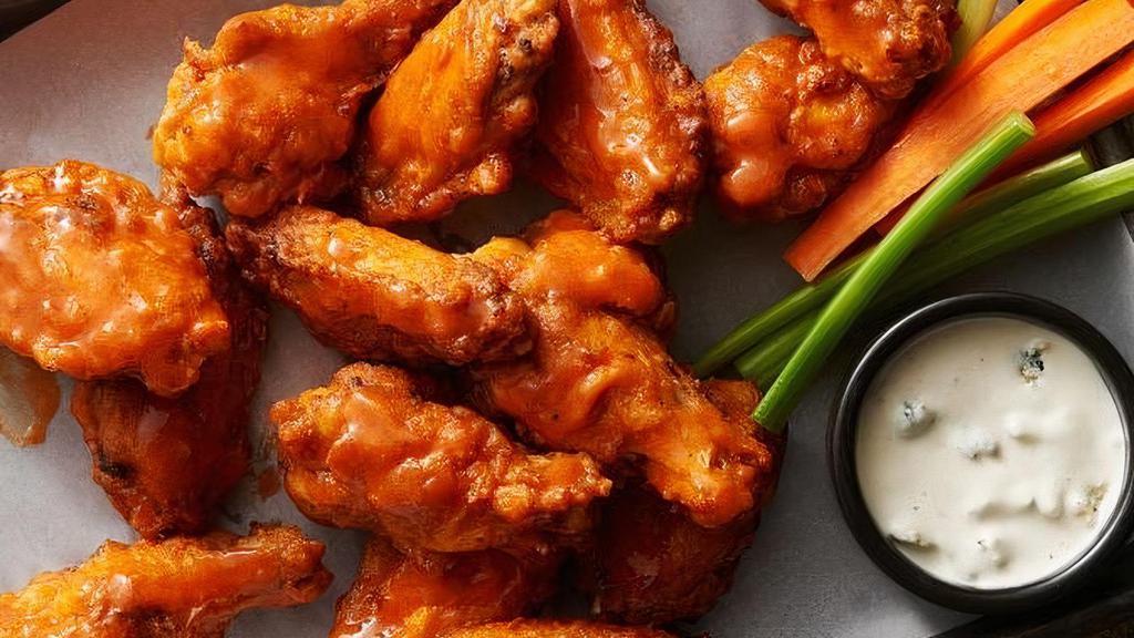 18 Dragon Wings, Ultimate Crispy Fries And 2 Soda · 18 pieces tossed in your choice of sauce, gluten-free. Choice of honey chipotle, buffalo sauce, homemade BBQ sauce, and honey buffalo sauce. Choice of homemade ranch or homemade blue cheese dressings, celery, and carrots.