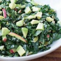 Organic Kale Caesar Salad · Avocado, apples, seasoned croutons, shaved parmesan cheese, and homemade caesar dressing.