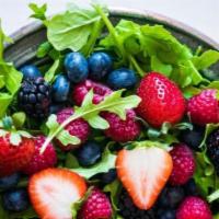 Wandering Strawberry Salad · Organic fresh berries, fried goat cheese, walnuts, baby arugula, strawberry vinaigrette.