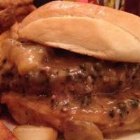 Burger Au Poivre · 8 oz. Organic angus beef blend, peppercorn, and Hennessy VSOP cream sauce. On an Amy's Brioc...