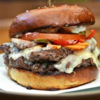 Southern Burgers (8 Oz) · 8 oz organic Angus beef served with lettuce, tomatoes, onions, and homemade pickles topped w...