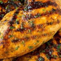 Marinated Organic Chicken Breast Side · Marinated with thyme, lemon hints, garlic, parsley.