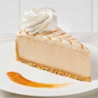 Dulce De Leche™ Cheesecake · Creamy caramel cheesecake baked on a vanilla crumb and topped with caramel swirled mousse an...