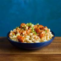 Buffalo 3-Alarm Chicken Kraft® Mac & Cheese · KRAFT White Cheddar Mac & Cheese topped with crispy chicken tender pieces glazed with TAPATI...
