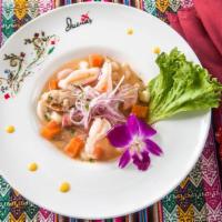 Ceviche De Pescado · Fish ceviche marinated in lime juice and Peruvian chili peppers.