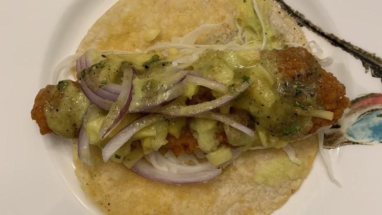 Fish Tacos · With roasted corn, onions, cilantro, cabbage and pineapple sauce.