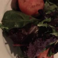 Insalata Mista · Mixed greens with tomatoes in a house vinaigrette.