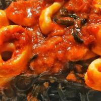 Black Linguini · Tossed with calamari in a spicy arrabbiata sauce.
