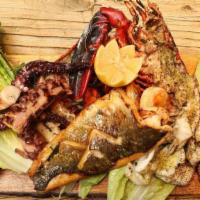 Grilled Mixed Sea Food For Two Or More · Fillets of branzino, grilled prawns, grilled octopus, grilled calamari and lobster on the sh...