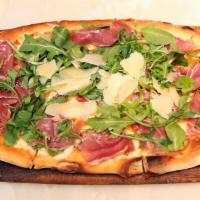 Prosciutto Pizza · Cherry tomatoes, mozzarella, Parma prosciutto, arugula and Parmesan.