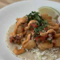 Baja Style Crispy Fish Taco (3) · Crispy fried fish with cabbage slaw, cilantro, pico de gallo, and chipotle aioli on a freshl...