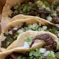Carne Asada Taco (3) · Seasoned steak served on a freshly made corn tortilla.
Served with onions, cilantro, lime, r...