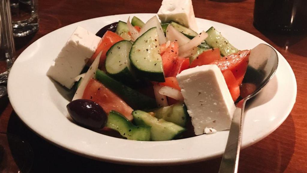 Horiatiki · Gluten free. Vegetarian. Traditional Greek salad with tomatoes, cucumbers, peppers, onions, olives and feta.