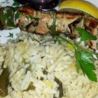 Kotopoulo Souvlaki · Gluten free. Chicken kebab with grilled onions and peppers over a leek and rice pilaf.