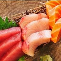 Tuna,Salmon & Yellowtail Sashimi · Eight pieces, two tuna, three salmon, three yellowtail.