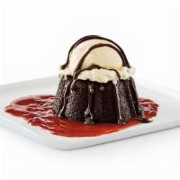 Gooey Chocolate Brownie Cake · Chocolate brownie cake with hot fudge and strawberry puree, served à la mode.. Comes cold, h...