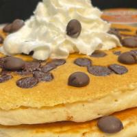 Chocolate Chip Pancakes · Fluffy Buttermilk Pancakes Loaded with and Topped with Chocolate Chips and Whipped Cream