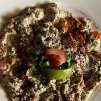 Baba Ganoush · Savory grilled eggplant blended with tahini, garlic and a splash of citrus, drizzled with ol...