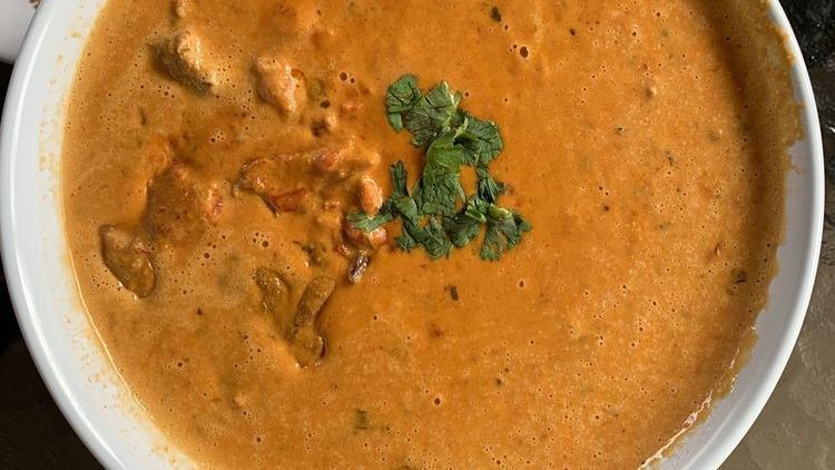 Butter Chicken · Aromatic golden chicken pieces in our creamy curry sauce.