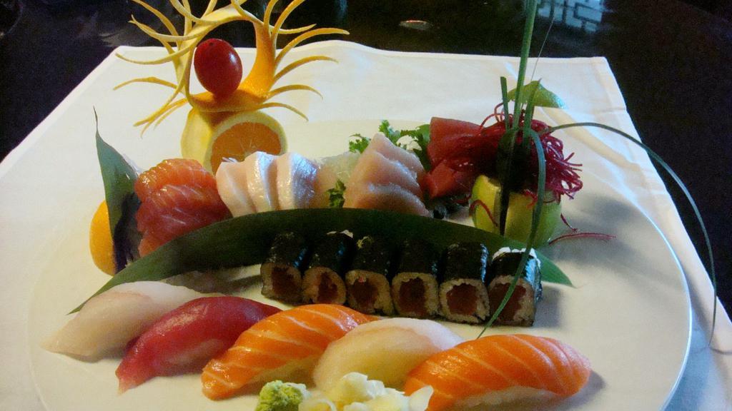 Sushi And Sashimi Combination · 5 pieces of sushi, 12 pieces sashimi, and 1 tuna roll. Served with miso soup.