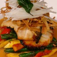Grilled Chilean Sea Bass · Grilled chilean sea bass on the bed of seasonal vegetables on top with fried gobo and scalli...
