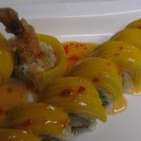 Golden Dream Roll · Fried shrimp and avocado inside, topped with sliced fresh mango and served with pineapple sa...
