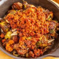 Brussel Sprouts & Chorizo · Roasted brussel sprouts, spicy chorizo, roasted almonds, truffle oil.