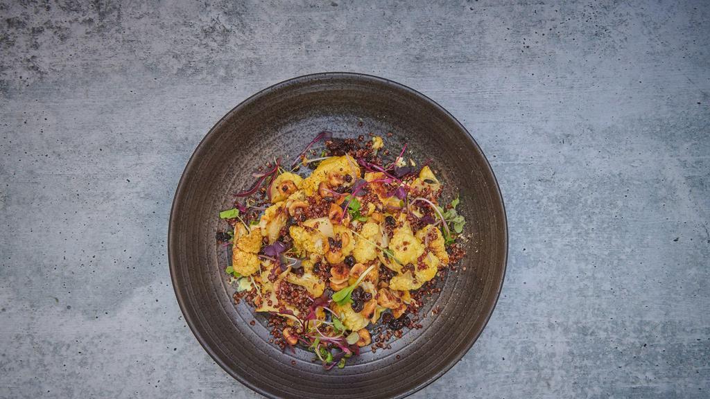 Roasted Cauliflower And Red Quinoa · Zante currants, toasted hazelnuts and turmeric or curry yogurt drizzle.