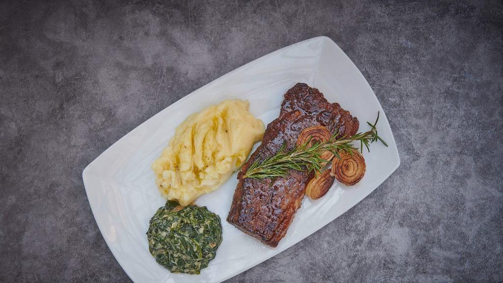 Our Mindful Steak Frites · Pasture grazed new york strip with house cut french fries.