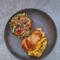 Penny Egg Sammy · Scrambled eggs with cheddar cheese and pesto on a fresh baked croissant or toasted brioche b...